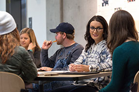 Photo of students. Link to What to Give.