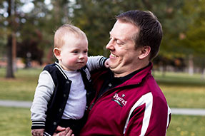Photo of a man holding a baby. Link to Gifts of Cash, Checks, and Credit Cards. Photo of a man holding a baby. Link to Gifts of Cash, Checks, and Credit Cards.